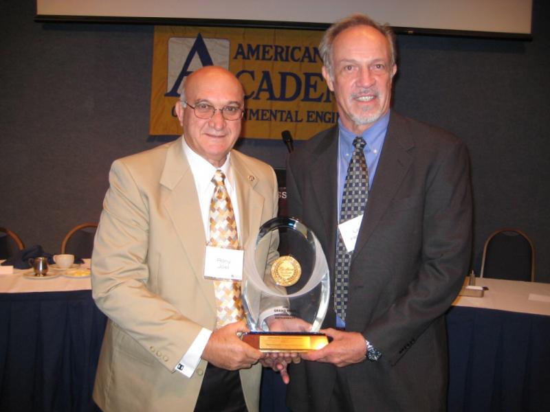 Mr. Joel receiving an award from the American Academy of Environment Engineers, 